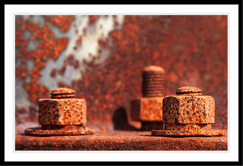 Close-up shot of rusted nuts and bolts.